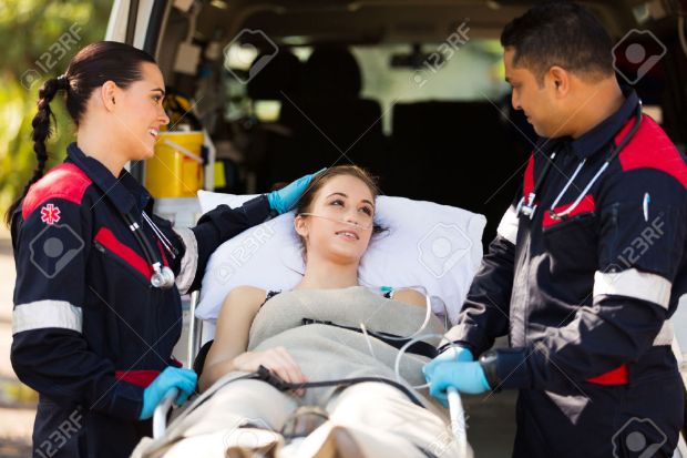 29603472-friendly-paramedic-comforting-young-patient-before-transporting-her-to-hospital-stock-photo